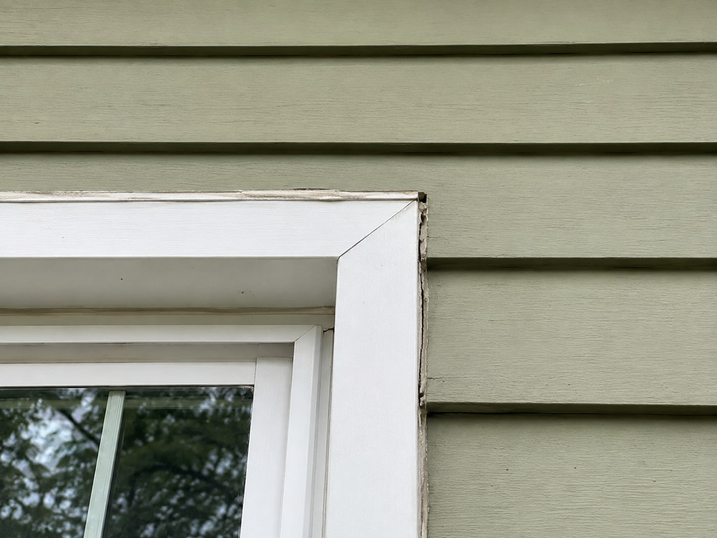 Window trim joint and adjacent cladding.