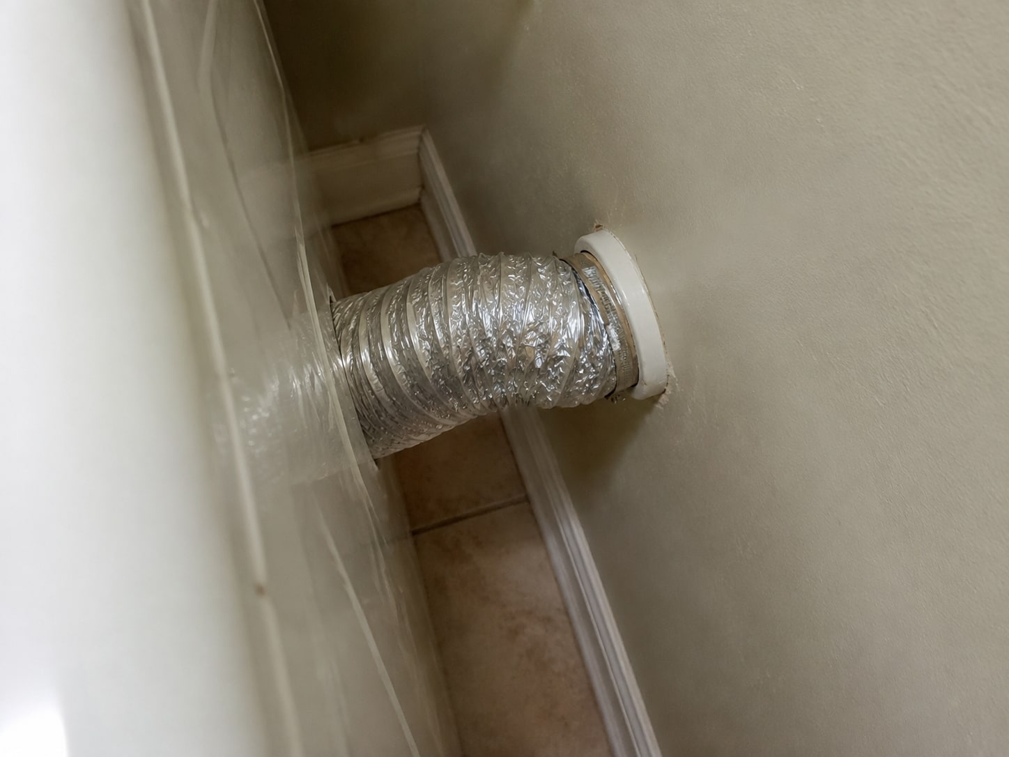 Compressed transition duct behind the dryer.