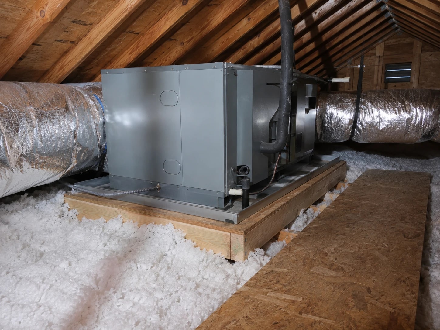 Upper-floor air handler and attic service area.
